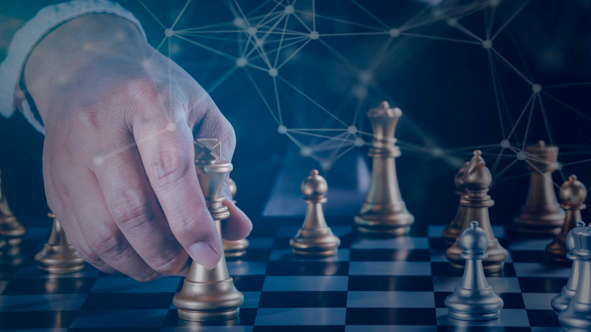 Businessman Moving a Chess Piece